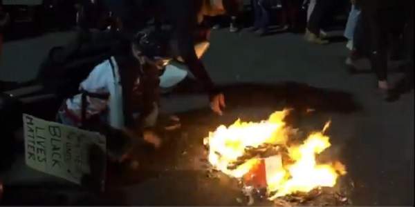 Protesters burn Bibles in Portland, rip protective boarding off buildings