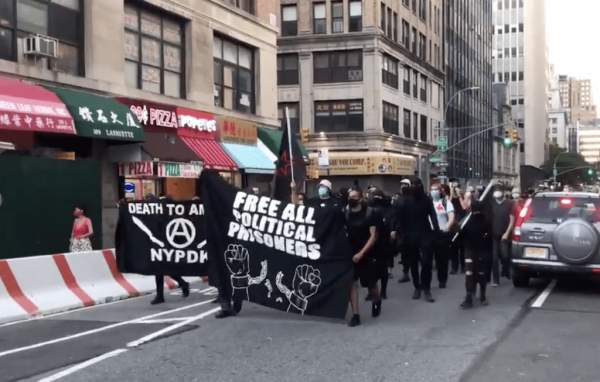 New York City protestors carrying signs demanding "Death to America"