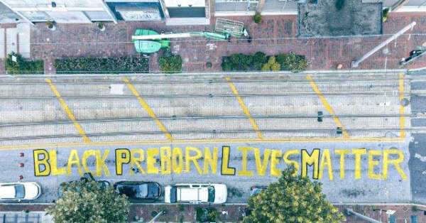 Students for Life Paint 'Black Preborn Lives Matter' on Baltimore Street
