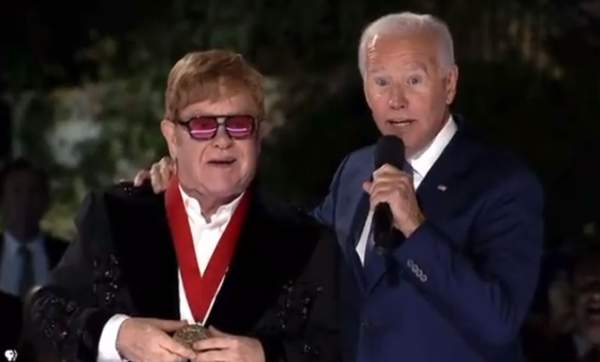 WOW! Joe Biden Wraps His Arm Around Elton John, Then Tells Crowd, "It's All His Fault We're Spending $6 Billion on HIV and AIDS this Month" (VIDEO)