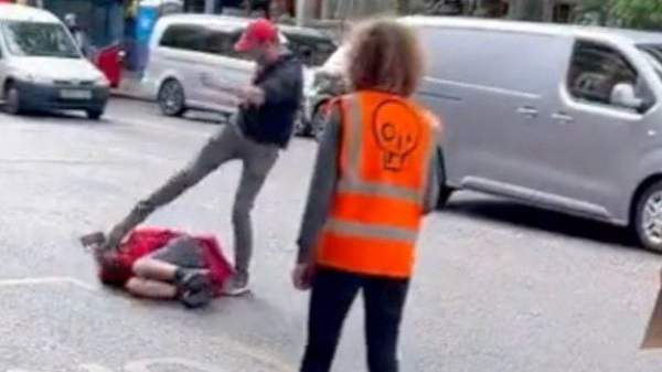 Angry British Driver Beats Up Crazy Climate Protester in Street – Protester Was Blocking Traffic in the Middle of the Road (VIDEO)