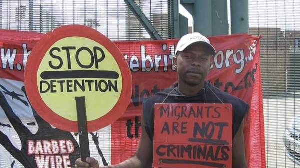 UK: Illegal migrant who protested with sign reading "Migrants are not criminals" pleads guilty to rape of 15-year-old girl