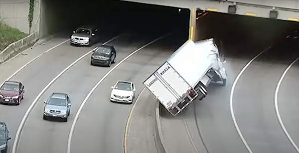 Traffic cams catch the moment that semi truck tips, shears off trailer roof in downtown Minneapolis tunnel
